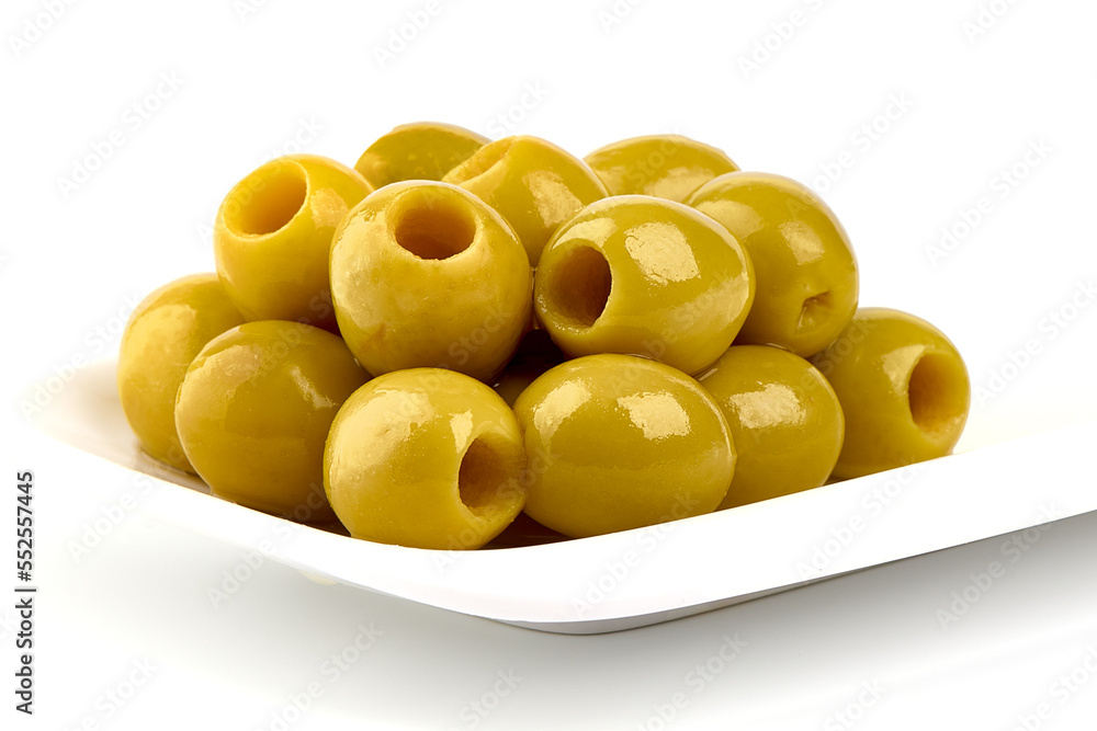 Green olives on white plate, isolated on a white background. Green olives on white plate, isolated on a white background.