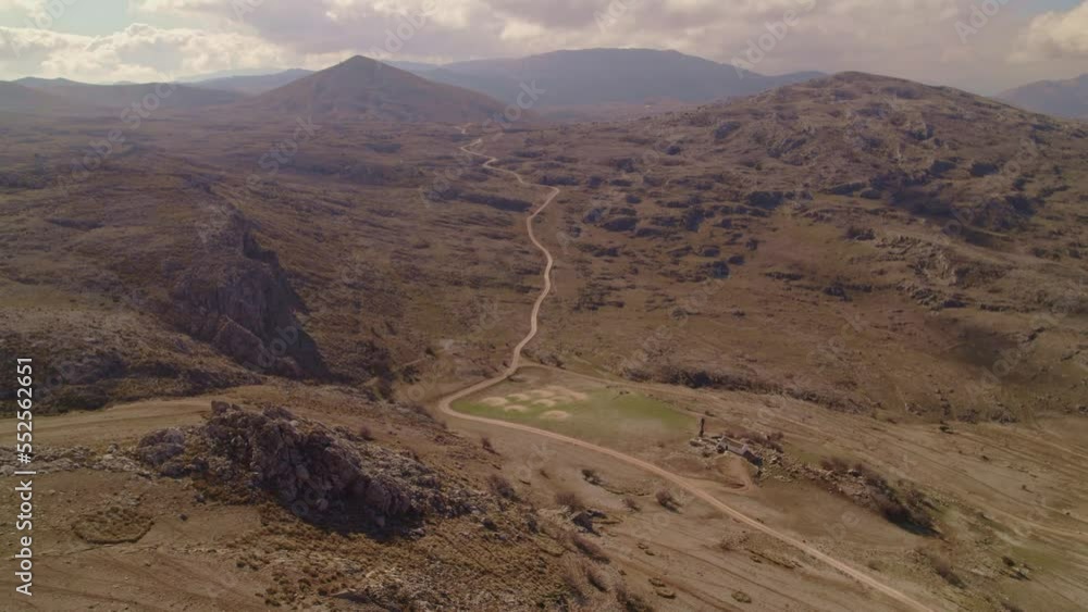 Rocky desert and road to the horizon. Panoramic aerial view from high altitude of large desert area. Granada. Spain. Rocky desert and road to the horizon. Panoramic aerial view from high altitude of large desert area. Granada. Spain.
