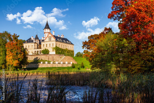 The mansion Radun in autumn colors  by a drained pond
