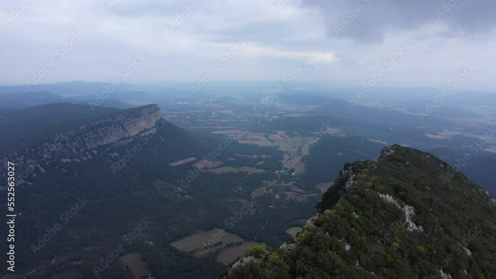 Aerial view over mountains in Herault department France cloudy day Aerial view over mountains in Herault department France cloudy day