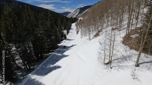 Aerial of snowmobile in snowy colorado winter vail pass closeup photo