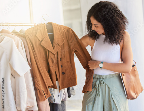 Retail, fashion and shopping with black woman in store buying for spree, luxury and products sale. Discount, consumer and expensive with girl customer in boutique mall spending for clothes deal