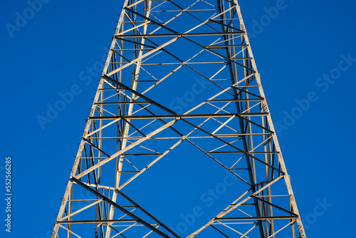 electric light pylon, steel structure for the infrastructure for the transport of electric cables with a grid of services and plants. symbol for industry and development.