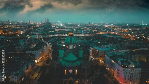 Munich city skyline aerial view at night munich germany panoramic view fly over munich church cathedral old town. photo