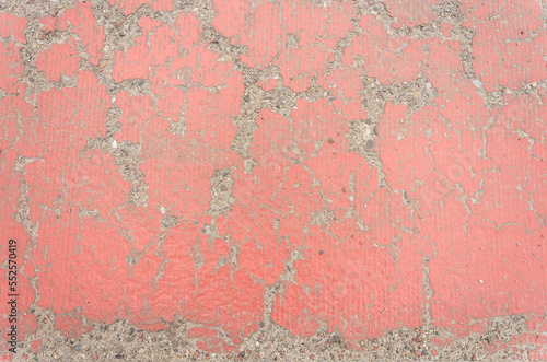 Damaged painted red asphalt texture for background, wallpaper