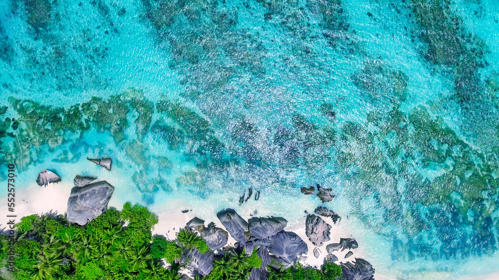 Overhead aerial view of Anse Source Argent Beach in La Digue, Seychelle Islands - Africa