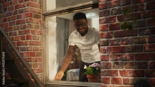 Wallpaper Mural Black Man Opening his Bedroom Window in the Morning and Filling his Lungs with Fresh Air. Happy Young Male Moved to a new City Enjoying his Apartment's Location and Welcoming a New Day Torontodigital.ca