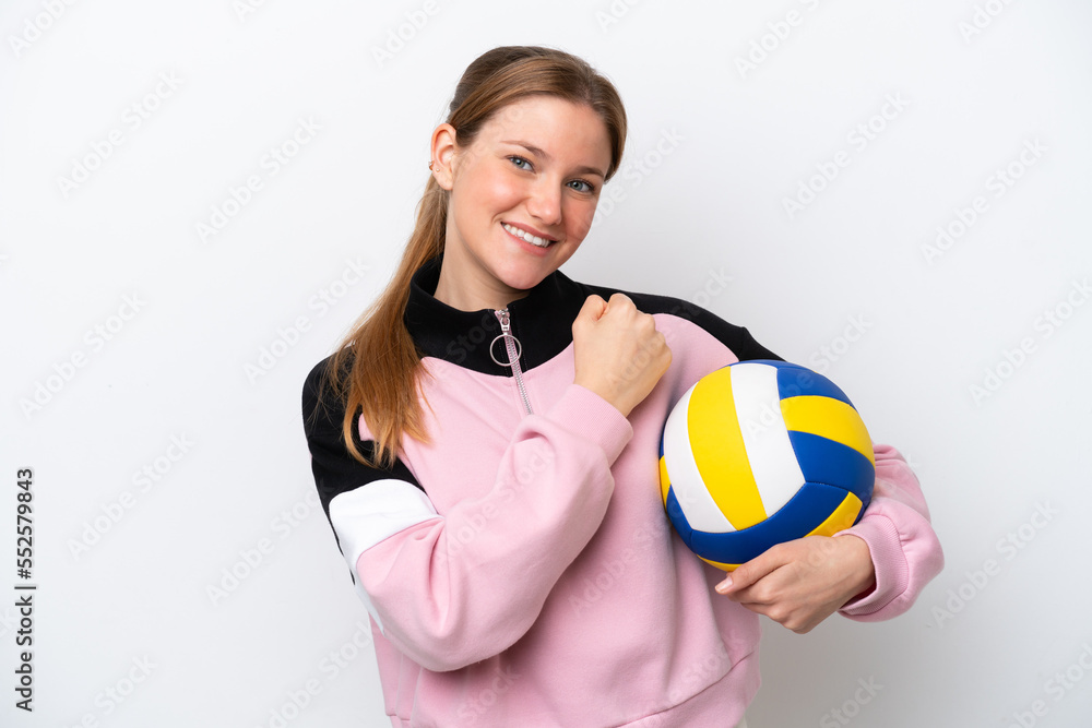 Young caucasian woman playing volleyball isolated on white background celebrating a victory Young caucasian woman playing volleyball isolated on white background celebrating a victory