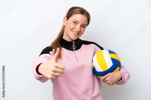 Young caucasian woman playing volleyball isolated on white background with thumbs up because something good has happened