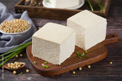Block of fresh Tofu on wooden background
