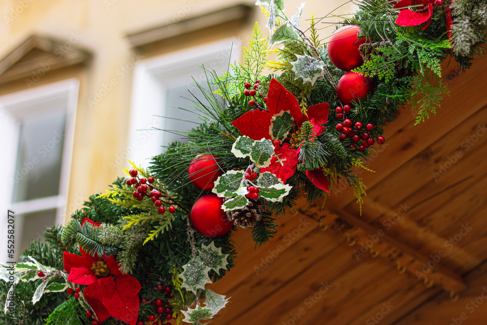Christmas garland on the roof of a wooden house close up. winter and New Year festive decoration of the streets Christmas garland on the roof of a wooden house close up. winter and New Year festive decoration of the streets