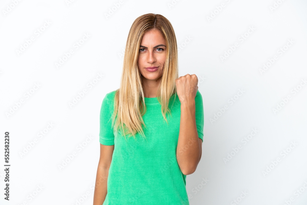 Blonde Uruguayan girl isolated on white background with unhappy expression Blonde Uruguayan girl isolated on white background with unhappy expression