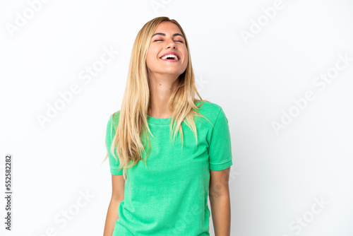 Blonde Uruguayan girl isolated on white background laughing © luismolinero