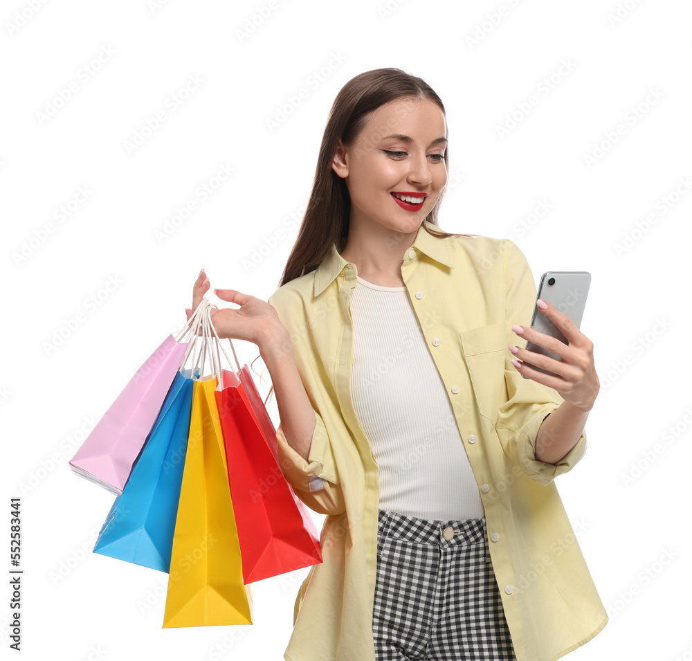 Stylish young woman with shopping bags and smartphone white background Stylish young woman with shopping bags and smartphone white background