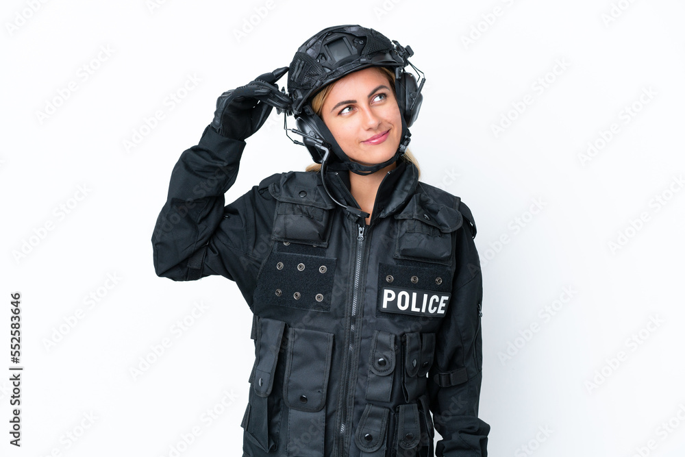 SWAT caucasian woman isolated on white background having doubts and with confuse face expression SWAT caucasian woman isolated on white background having doubts and with confuse face expression