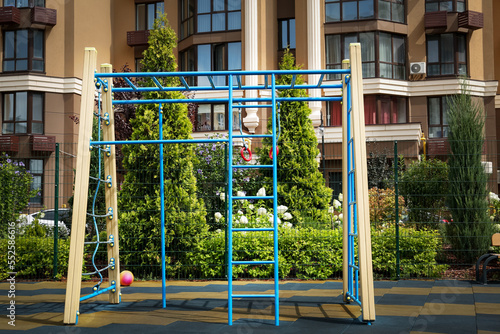 Canvas Print Empty monkey bars on outdoor children's playground in residential area