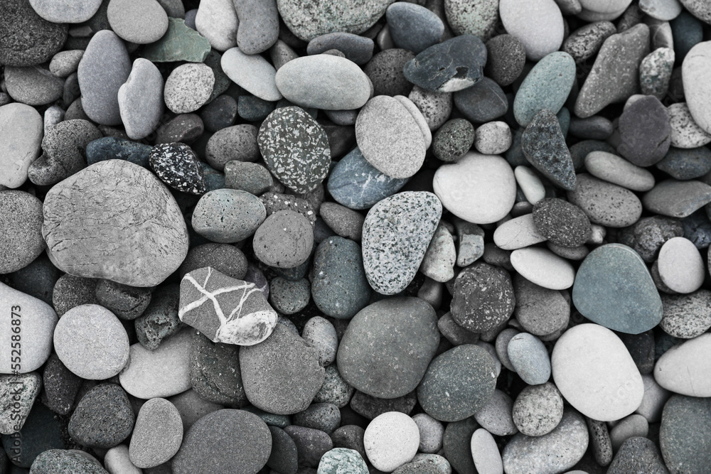 Many different pebbles as background, top view Many different pebbles as background, top view