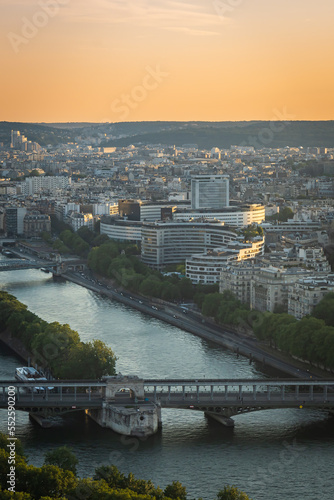 Cityscape of Paris at sunset with a view on the Seine river and the Ile aux Cygnes island