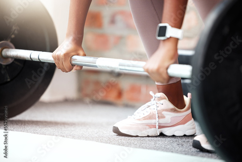 Weightlifting, start and hands of a woman at the gym, health exercise and workout training for fitness. Sports, wellness and athlete with weights for power, strong muscles and bodybuilder sport