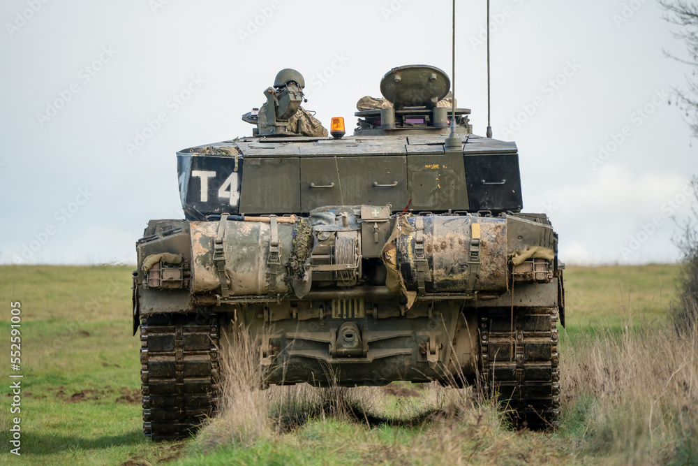 Fototapeta premium detailed close up of a commander and gunner directing action in a British army FV4034 Challenger 2 ii main battle tank on a military combat exercise, Wiltshire UK