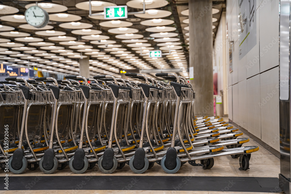 Baggage trolley grouped at the airport to serve traveling passengers