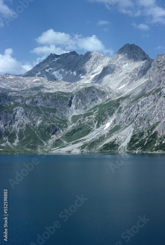 Fototapeta Naklejka Na Ścianę i Meble -  Natural landscape with high mountain peaks of the Rhaetikon in the Eastern Alps at the Luener Lake in Austria