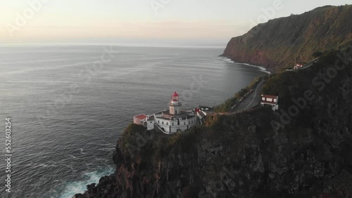 Wallpaper Mural Epic sunrise, drone shot of Lighthouse Farol Ponta do Arnel on San Miguel Island. Aerial view of amazing landscape of Lighthouse on island in atlantic ocean, 4k footage. Azores, Atlantic Coastline Torontodigital.ca