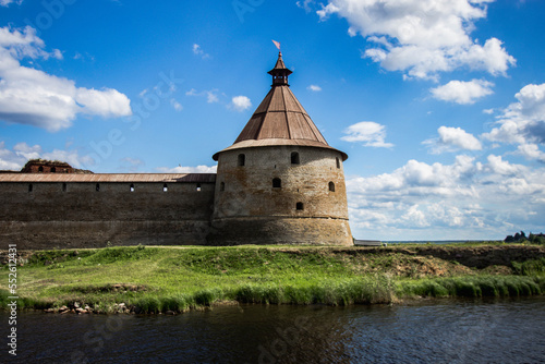 Oreshek fortress tower against a cloudy sky. Horizontal photo