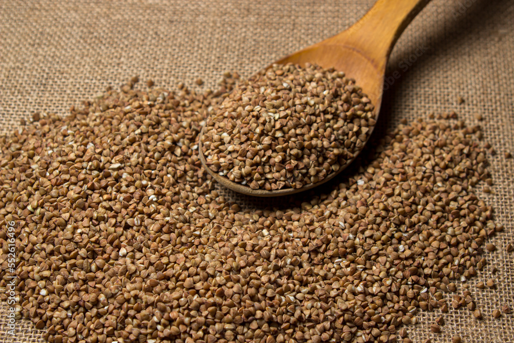 Buckwheat on a background of burlap. Tasty and healthy food Buckwheat on a background of burlap. Tasty and healthy food