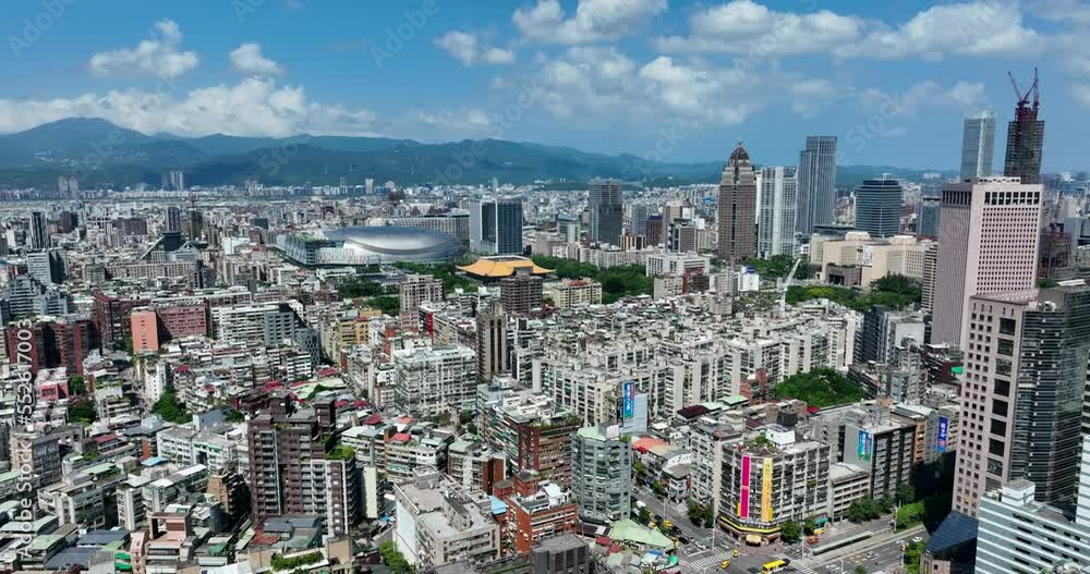 Drone fly over the Taipei city with blue sky Drone fly over the Taipei city with blue sky