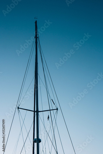 Fototapeta Close-up of yacht masts against the blue sky. Marine theme