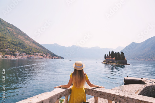woman in yellow dress enjoying view on the bay in Montenegro © Ivan