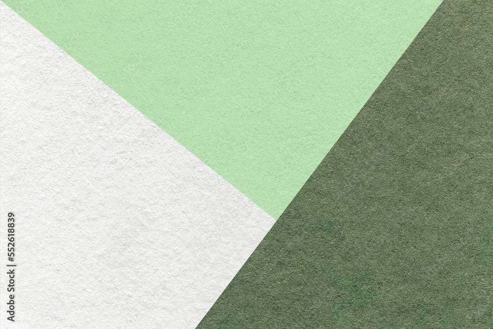 Fototapeta premium Texture of craft light green and white shade color paper background, macro. Vintage abstract olive cardboard