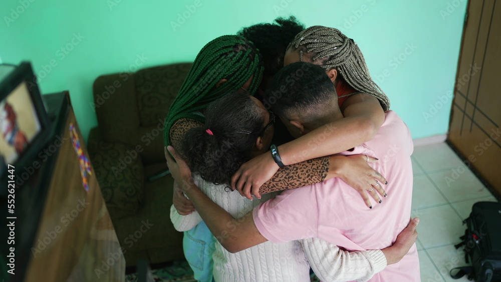 Happy hispanic family hugging each other at home. South American people embraces Happy hispanic family hugging each other at home. South American people embraces