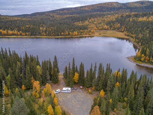 aerial view camping caravan near river autumn fall landscape along Ammarnas National Park in Lapland Sweden photo