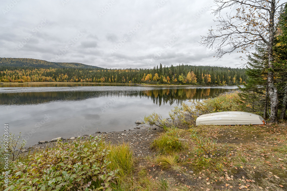 camping caravan near river autumn fall landscape along Ammarnas National Park in Lapland Sweden