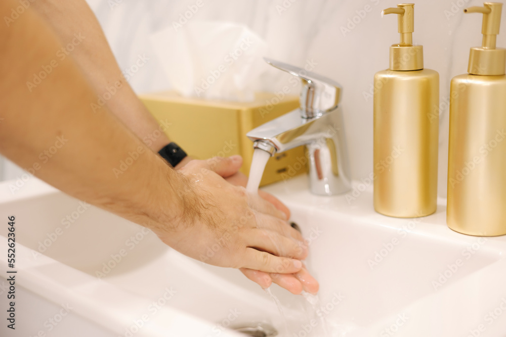 First person view of man washing his hand under the water tap. Hygiene concept hand detail. Close-up of human hands. Keep clean concept First person view of man washing his hand under the water tap. Hygiene concept hand detail. Close-up of human hands. Keep clean concept
