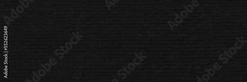 black texture with brick wall for background website or brickwork for design. horizontal part of black painted brick wall