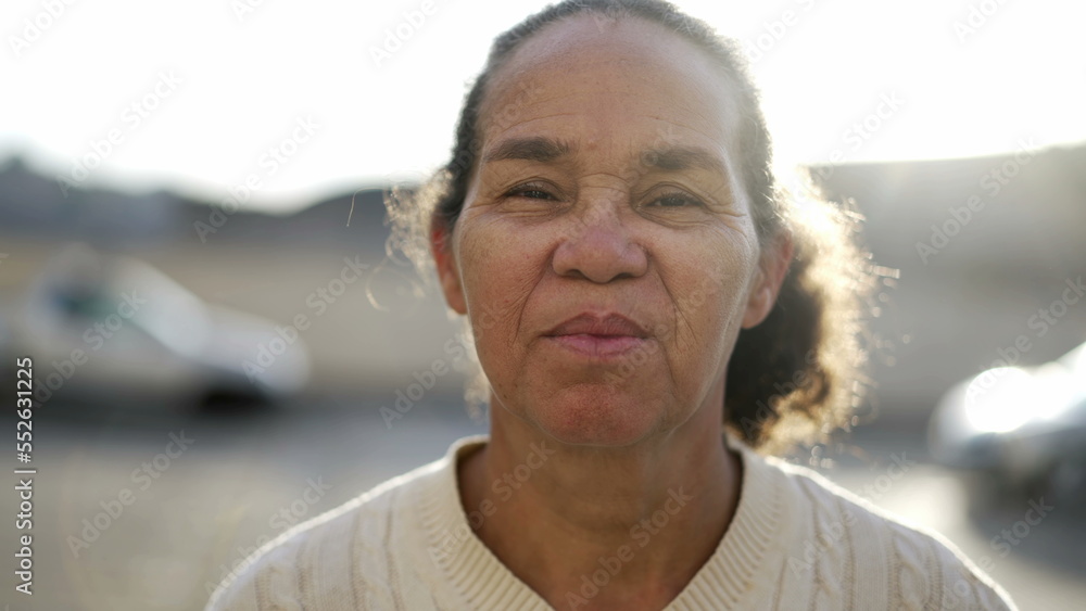 One hispanic older looking at camera with serious expression. Portrait of a mature South American senior lady One hispanic older looking at camera with serious expression. Portrait of a mature South American senior lady