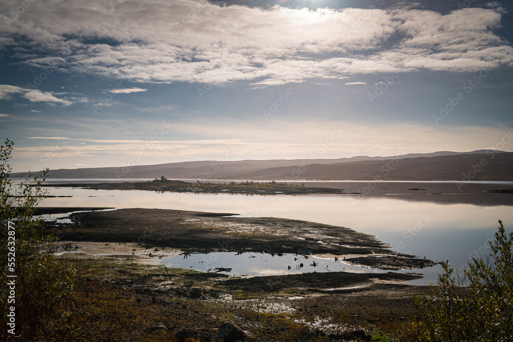 Obraz premium A bright autumnal HDR image of Loch Shin with lower than normal water from the A838 near Fiag Bridge, central Sutherland, Scotland