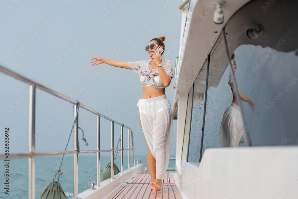 luxury relaxing couple traveler of cruise yacht with background of sea and white sky. Concept business travel. Cruise luxury travel lifestyle woman on vacation. luxury relaxing couple traveler of cruise yacht with background of sea and white sky. Concept business travel. Cruise luxury travel lifestyle woman on vacation.