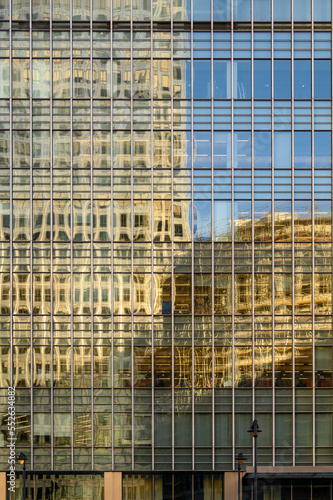 Modern office skyscrapers reflected in windows