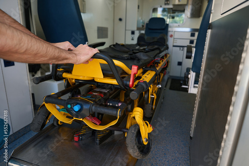 Cropped photo of stretcher in a modernly equipped ambulance