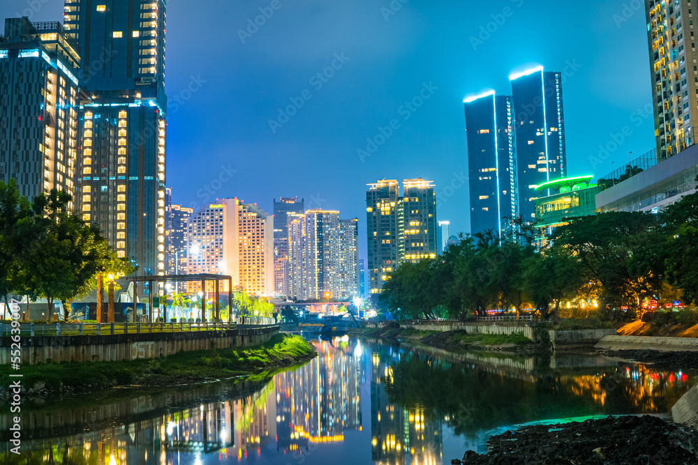 Night cityscape around waduk Kebon Melati. Jakarta, Indonesia.