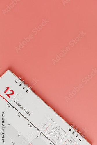 December 2022 Calendar on red background with copy space. Vertical, flat lay, top view. business planning appointment meeting concept.