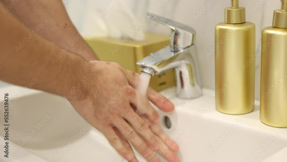First person view of man washing his hand at home. Close-up of human hands. Keep clean concept First person view of man washing his hand at home. Close-up of human hands. Keep clean concept