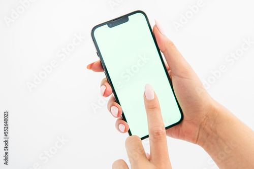 hand holding green screen phone photo