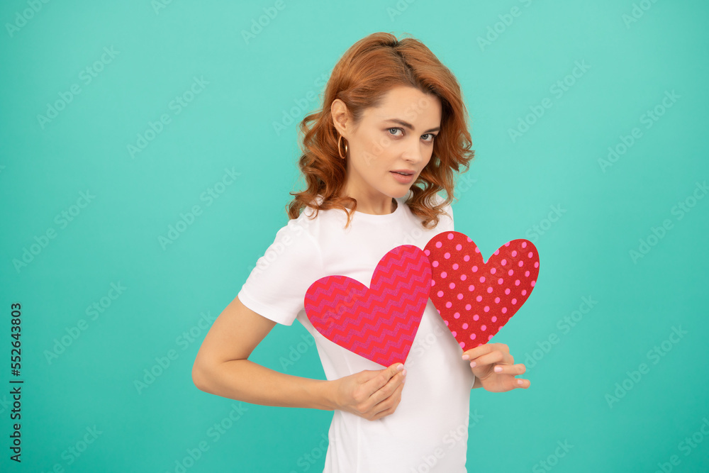 young girl with red heart on blue background young girl with red heart on blue background