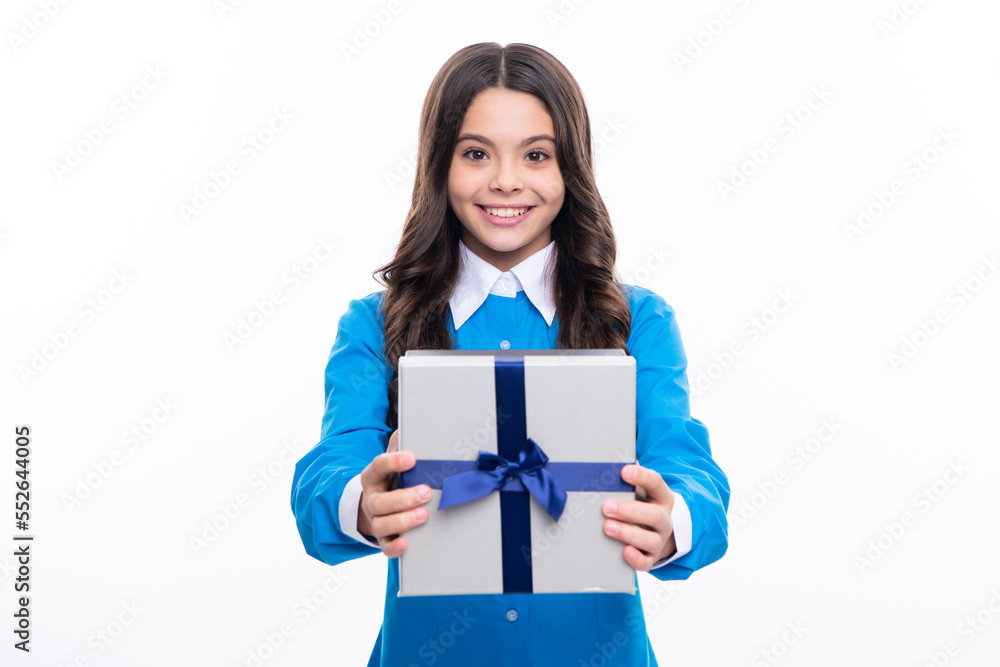 Young teenager girl child holding gift box isolated on white background. Gift for kids birthday. Young teenager girl child holding gift box isolated on white background. Gift for kids birthday.