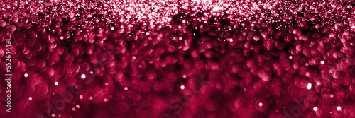Trendy viva magenta, pink sparkling glitter bokeh panoramic background banner, abstract defocused texture header. Holiday lights. Color of the year 2023